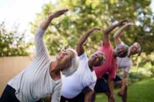 Seniors doing yoga.