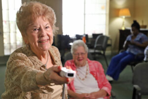 The Windsor assisted living experience is all about helping seniors stay connected and engaged like Wii bowling.