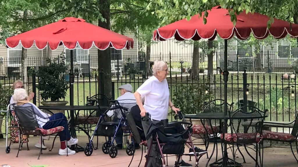 Seniors sitting outdoors at assisted living on the Northshore