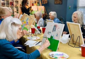 Seniors painting in retirement homes near Covington