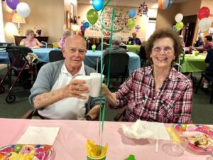 Senior couple enjoying party together at retirement communities near Kenner