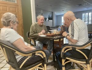 Seniors playing chess at independent living retirement communities near me